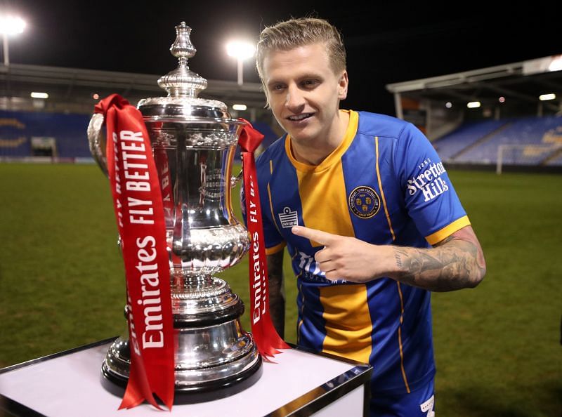 Shrewsbury two-goal hero on Sunday Jason Cummings posing with the FA Cup trophy