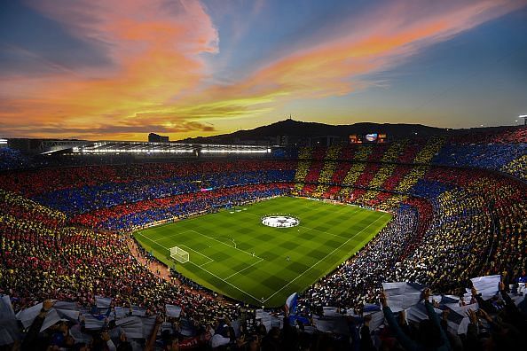 The iconic Camp Nou stadium with Cules holding up the tifo