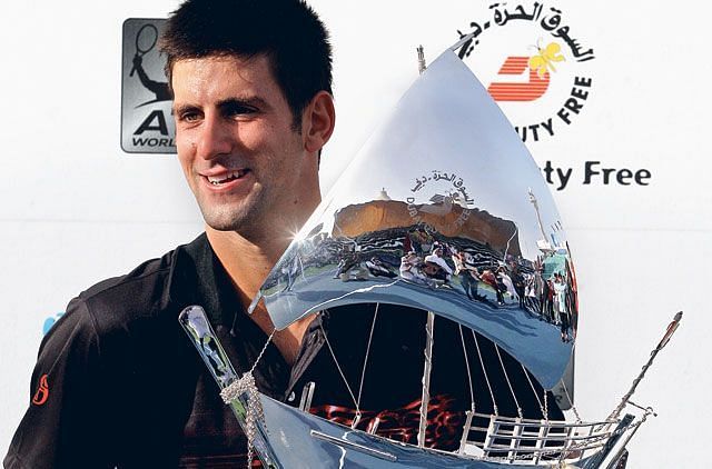 Djokovic poses with his 2010 Dubai title