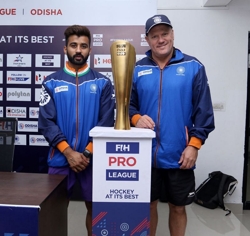 India coach Graham Reid and captain Manpreet Singh with Pro League Trophy