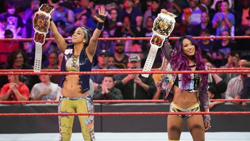 Bayley &amp; Sasha Banks holding the Women&#039;s Tag Team Titles.