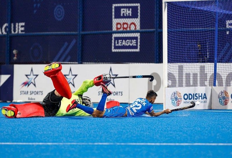 Vivek gets one into the net during the shootout