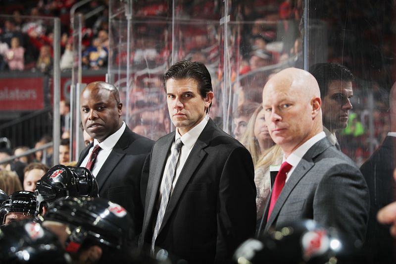 New Jersey Devils assistant coach Mike Grier (left)
