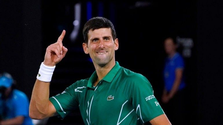 Novak Djokovic rejoices after winning his 8th title at the Australian Open