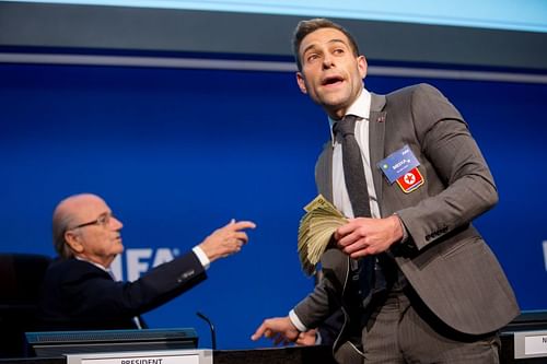 FIFA President Sepp Blatter (left) is heckled prior to a press conference by Simon Brodkin AKA Lee Nelson