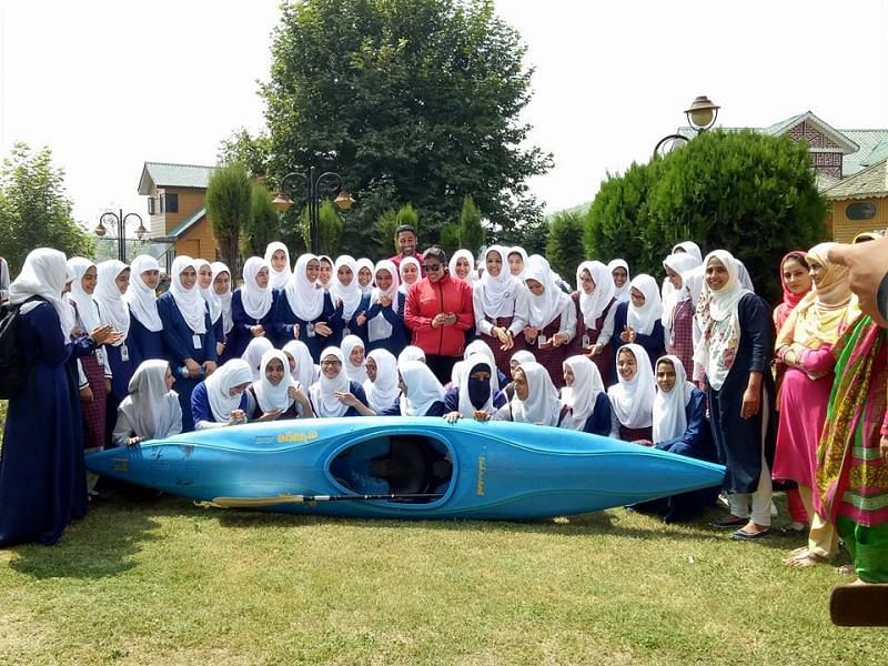 Bilquis Mir (in centre in red) trains hundreds of young children from the valley at the Dal Lake (Image credits - Bilquis Mir/Facebook)