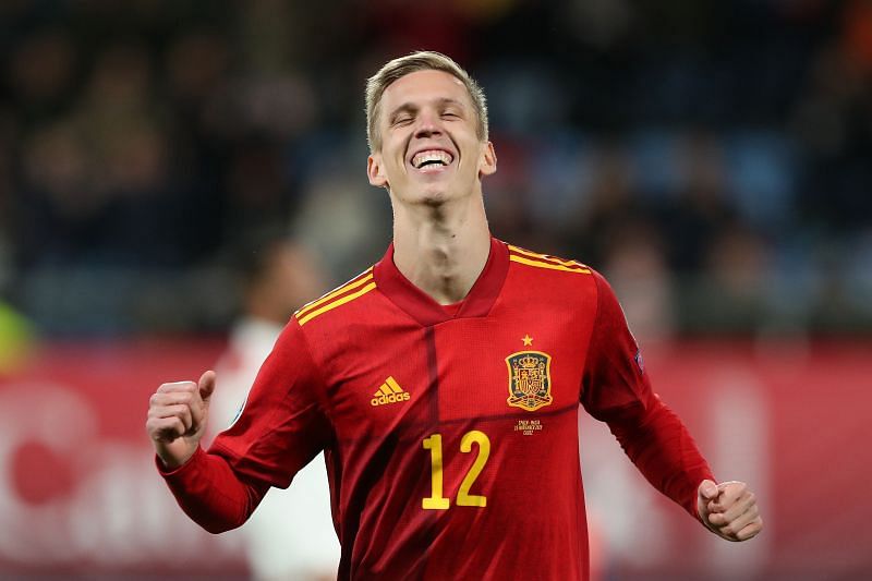Olmo celebrates after scoring on his debut for Spain