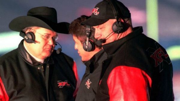 Jim Ross, some guy, and Jesse Ventura at an original XFL game