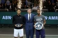 Felix Auger-Aliassime (left) poses with 2020 Rotterdam winner Gael Monfils