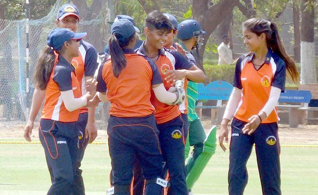 Kashvee Gautam celebrates one of her wickets during her historic spell.