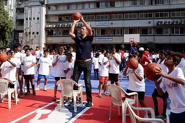 Kids from the Reliance Foundation Jr. NBA Program with Sacramento Kings legend Vlade Divac