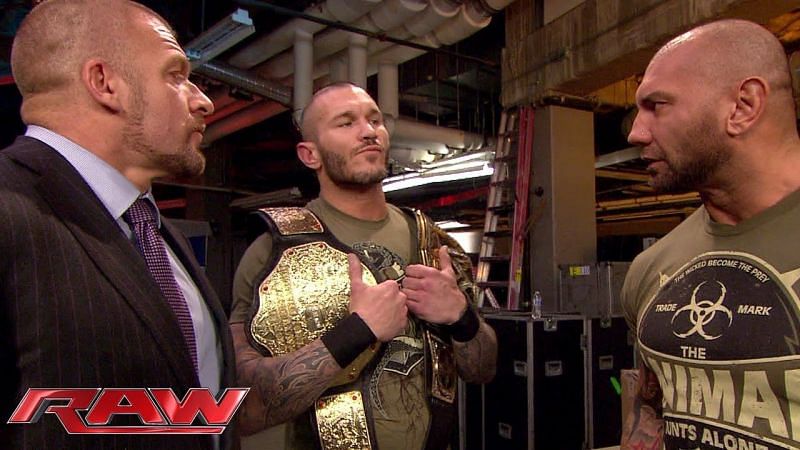 Batista and Randy Orton with Triple H