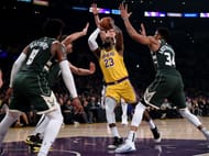 LeBron James recorded 37 points, 8 rebs and assists in the Lakers' 113-103 win over Milwaukee on Friday