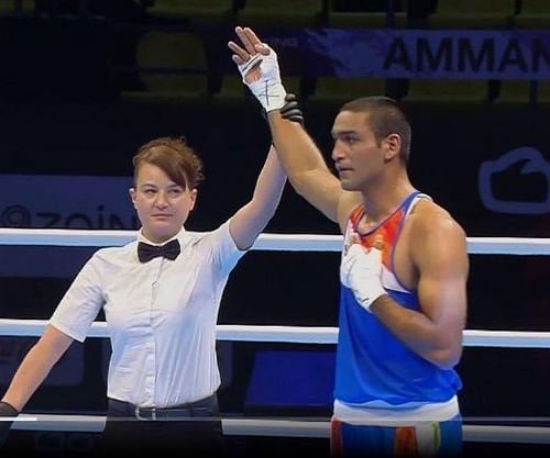 Ashish Kumar is through to the quarter-finals in the 75 kg weight category