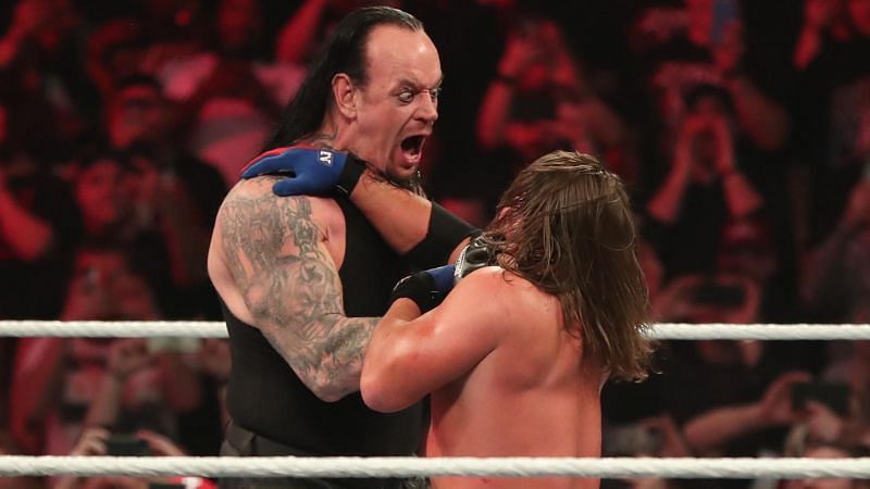 The Undertaker attacks Styles at Elimination Chamber