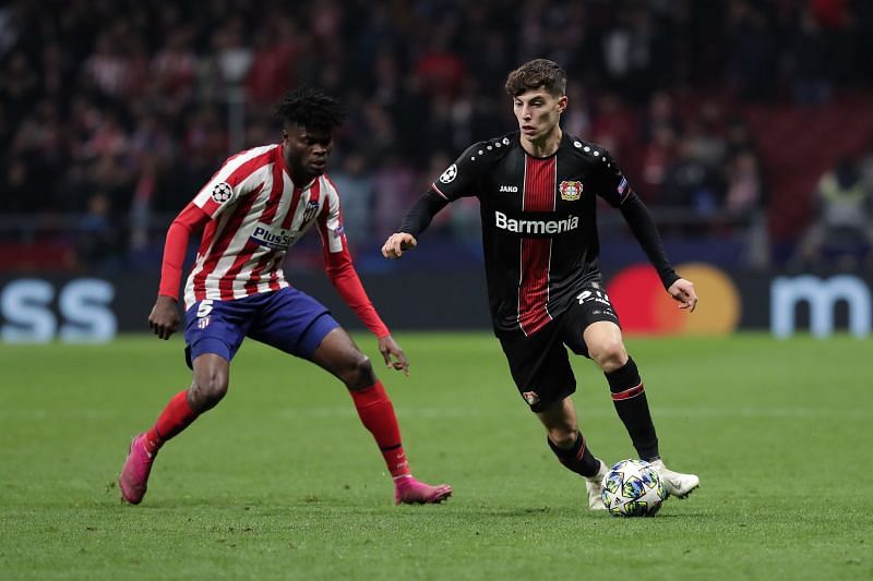 Kai Havertz taking on Thomas Partey in a group stage game against Atletico Madrid