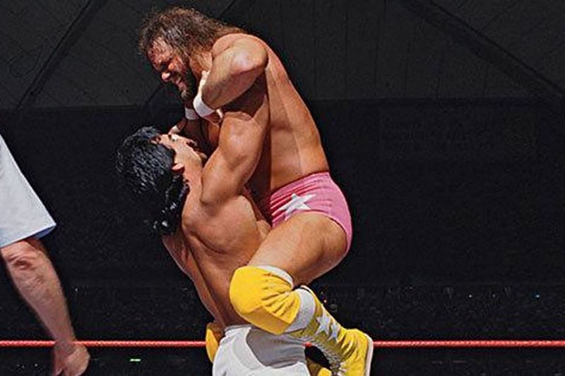 Ricky the Dragon Steamboat lifts his hated rival Macho Man Randy Savage into the air at Wrestlemania III