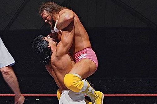 Ricky the Dragon Steamboat lifts his hated rival Macho Man Randy Savage into the air at Wrestlemania III