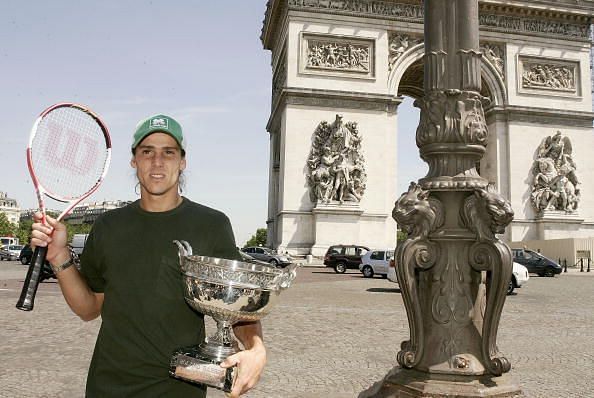 Gaston Gaudio poses with his 2004 Roland Garros title