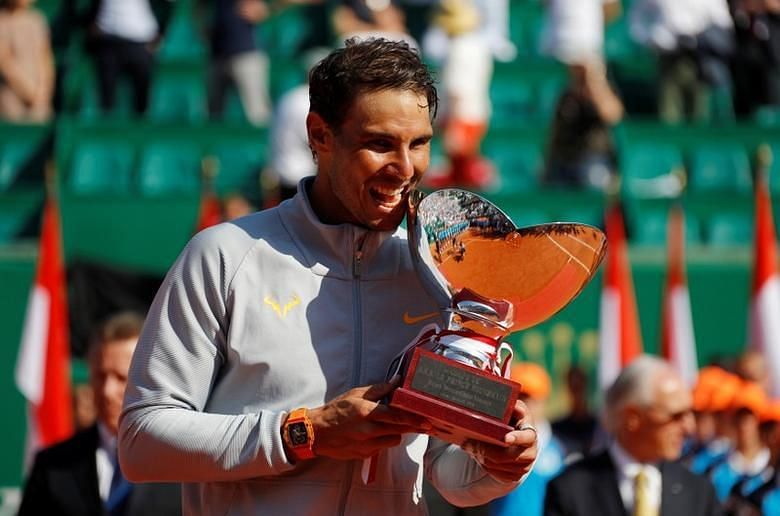 Nadal poses with his 11th Monte Carlo title in 2018.
