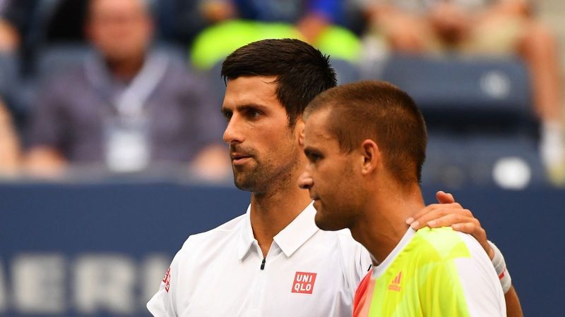 Djokovic with Mikhail Youzhny