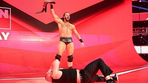 The Chosen One standing tall over the current WWE Champion, Brock Lesnar