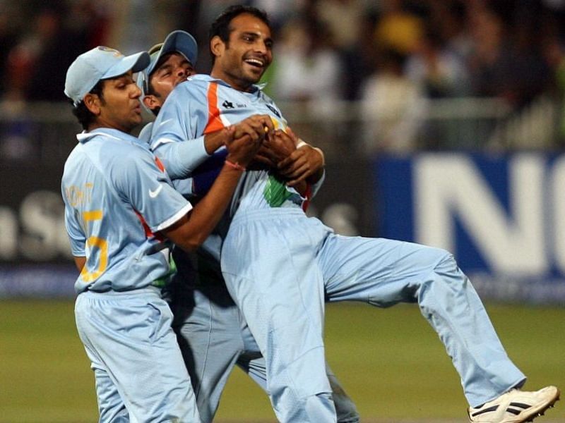 Joginder Sharma (R) is mobbed by his teammates after the final wicket