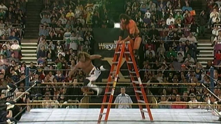 HBK takes a nasty tumble from the top of the ladder courtesy of Razor Ramon.