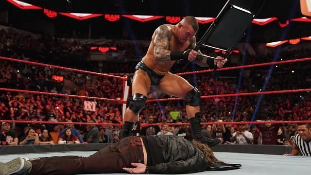 Randy Orton beating Edge with a steel chair