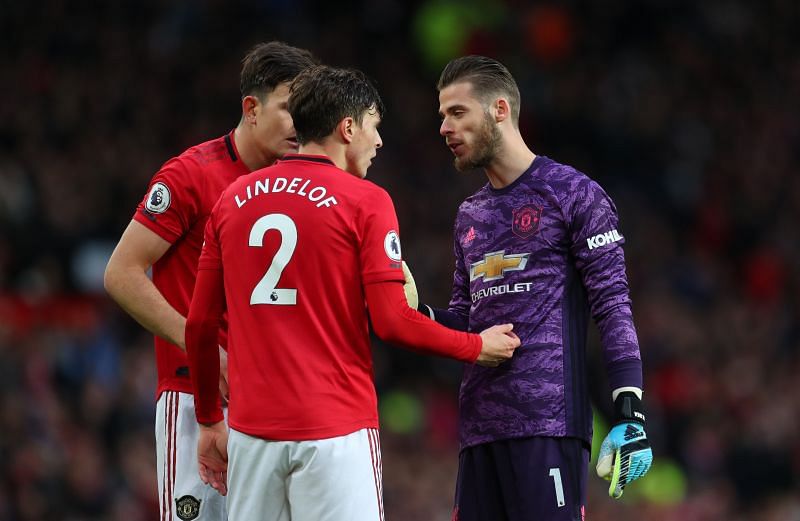 Manchester United&#039;s centre backs Harry Maguire and Victor Lindelof deep in conversation with their goalkeeper David de Gea
