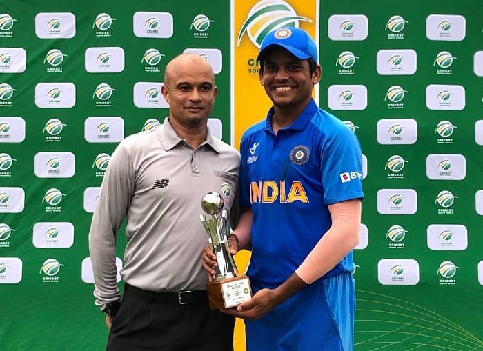 Priyam Garg receives the man of the match trophy