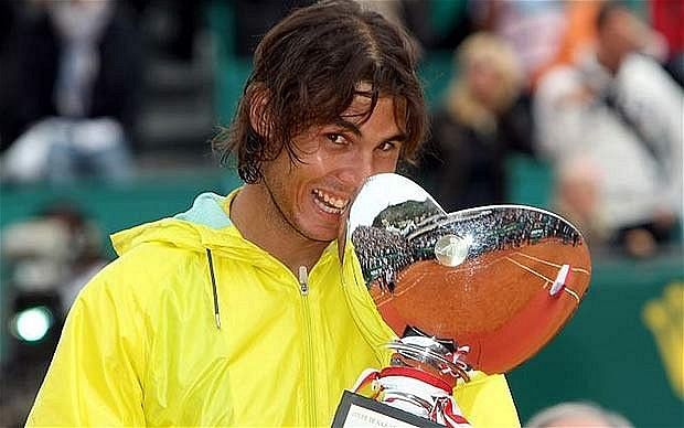 Nadal poses with his 8th consecutive Monte Carlo title in 2012.