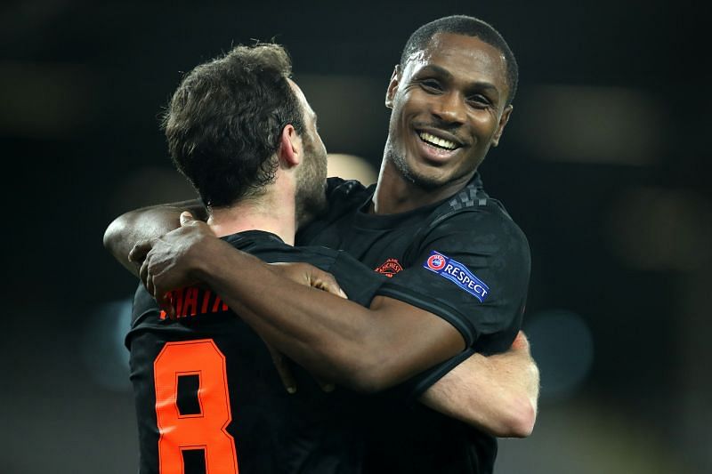 Ighalo celebrates a goal with Juan Mata.