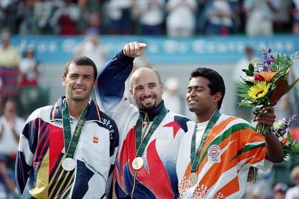 Leander Paes (R) with his Olympic bronze alongside Andre Agassi and Sergi Bruguera