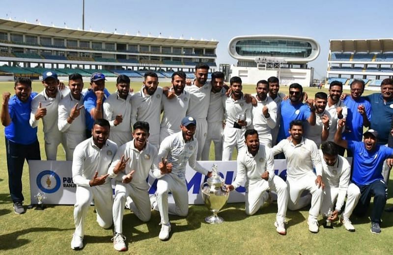 Saurashtra team pose with the trophy