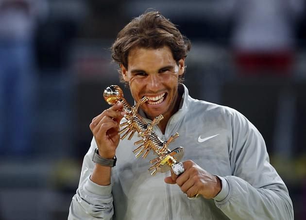 Nadal poses with his 2014 Madrid Masters title.
