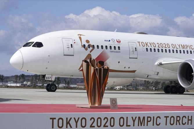 Olympic flame lands in Japan as doubts grow over Tokyo Games