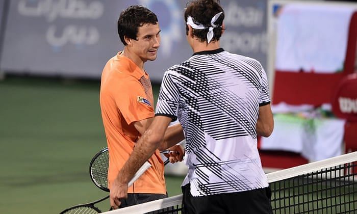 Evgeny Donskoy(right) stuns Federer in the second round of the 2017 Dubai Open.