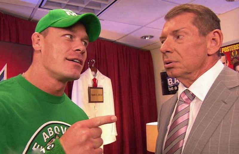 John Cena (left) with Vince McMahon