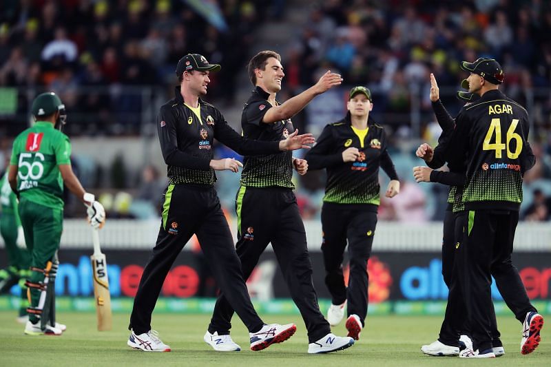 Pat Cummins (2nd from left) celebrates a wicket