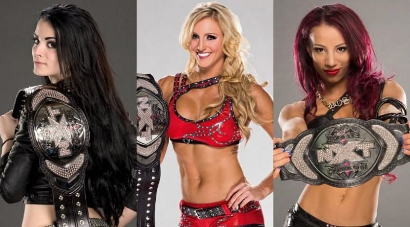 The first three NXT Women&#039;s Champions: Paige, Charlotte Flair, and Sasha Banks