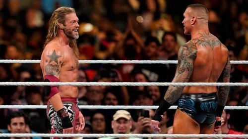 Edge facing off against Randy Orton (right)