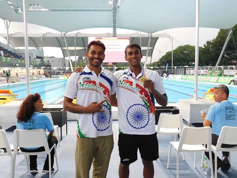 Likith (R) pictured with his coach, Partha