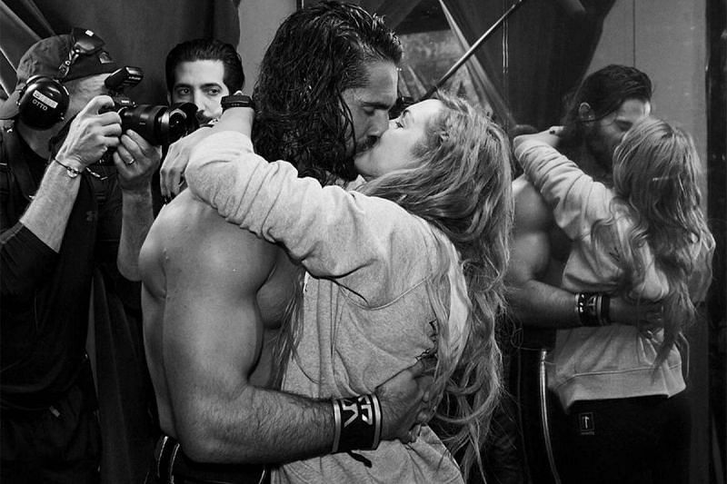 Seth Rollins and Becky Lynch share a kiss.