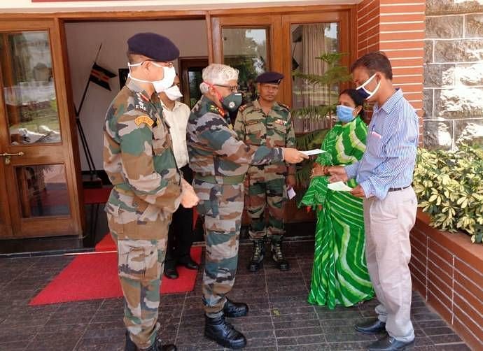 Lt. Gen. T.S.A. Narayanan, Commandant, MCEME handed out a cheque of Rs. 60,000 to the family of Bir Bahadur.