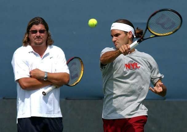 Roger Federer trains under the watchful eyes of Peter Lundgren