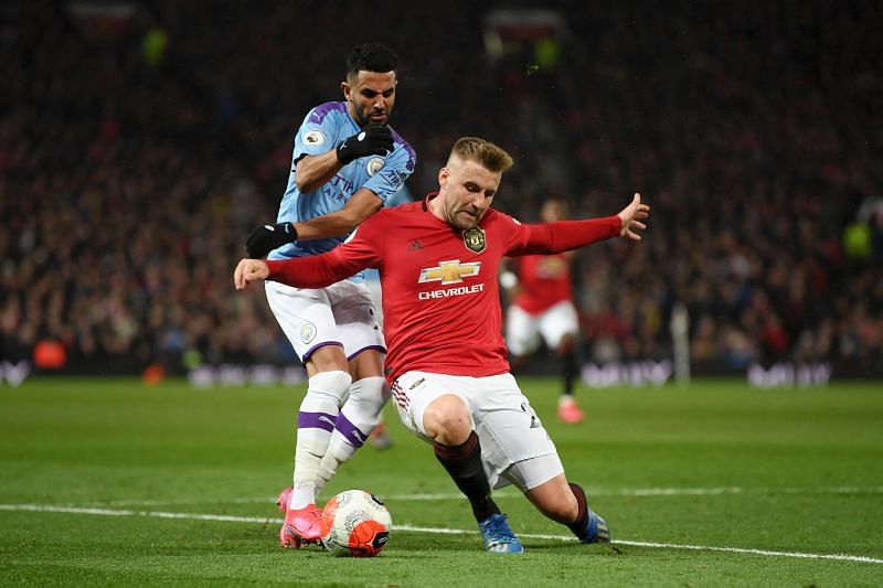 Luke Shaw vying for the ball with Riyadh Mahrez in the recent Manchester Derby