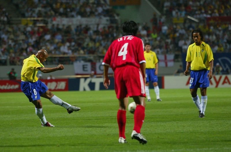 Roberto Carlos of Brazil scores the opening goal from a free-kick