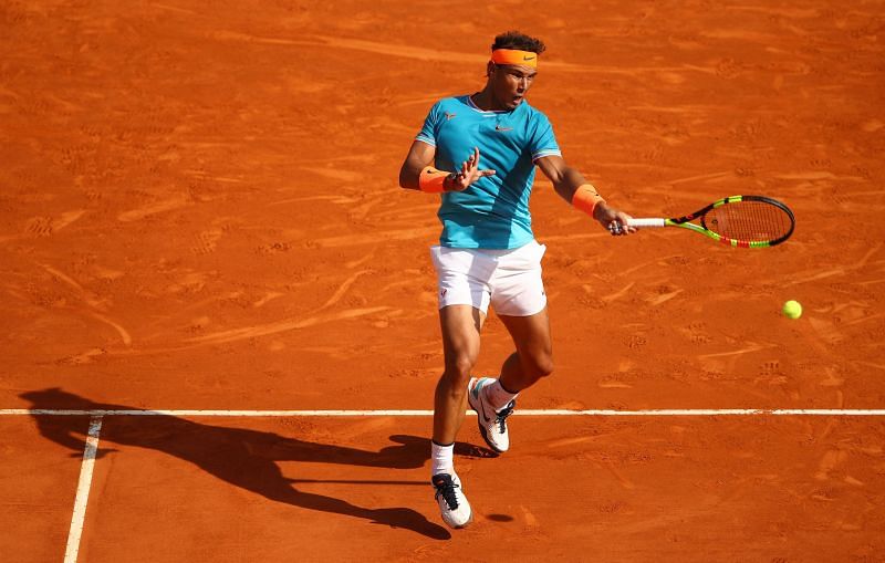 Rafael Nadal firmly positions himself before hitting a topspin forehand