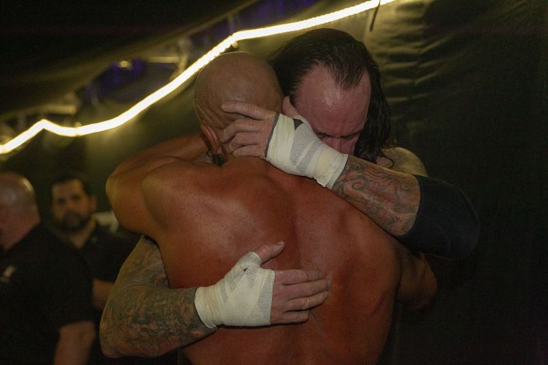 Undertaker and Triple H embrace backstage